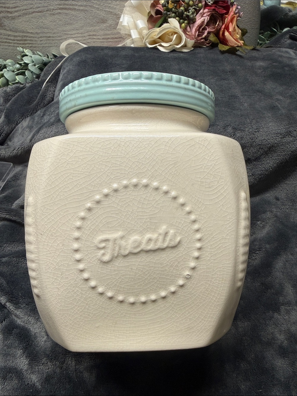 SCM Home stoneware cookie pet dog treat jar. Cream color with teal lid.
